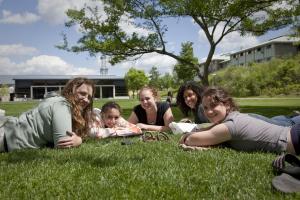 Students lounge on grass