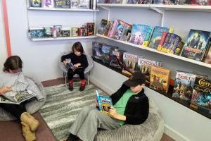 Kids reading graphic novels at Reading Party