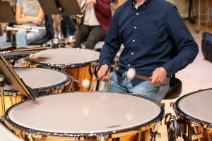 student playing percussion