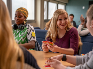 Students playing a card game.