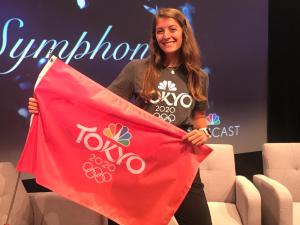 student with Olympics flag