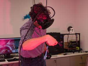 An individual with a virtual reality headset on. 