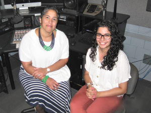 President Shirley M. Collado and student Farwa Shakeel '20 sit in the WICB production studio.