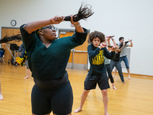 Student participating in African Drum and Dance