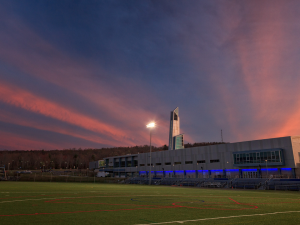A pink and blue view of the A&E Center at sunset.