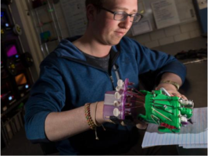 Student with 3D printed hand.