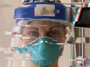 nurse in mask and face shield