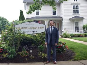 man in front of a funeral home