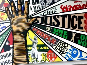 An image of a mural from the national museum for civil and human rights with an MLK Scholar logo overlay.