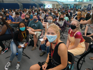 A crowd shot showing students in masks
