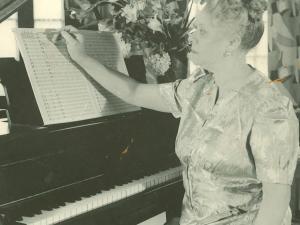 woman seated at piano