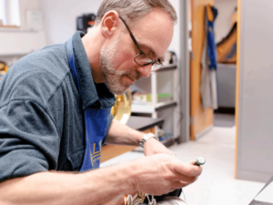 Neil Adams repairing an instrument