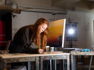 girl painting in art studio