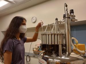 Student using an NMR machine.