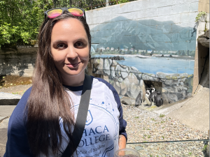 Brittany standing by penguin exhibit
