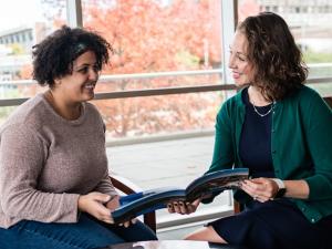 a female admission counselor talks with a female student