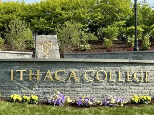 stone wall with words Ithaca College on it