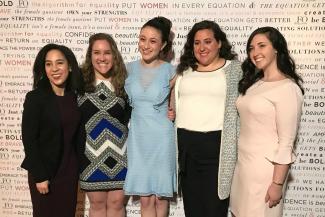 NYWICI scholarship recipients pose arm in arm