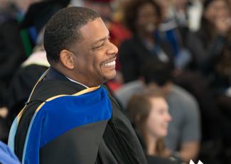 A. Van Jordan smiling in academic robes