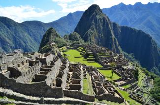 The stone ruins of Machu Picchu with mountains in the background