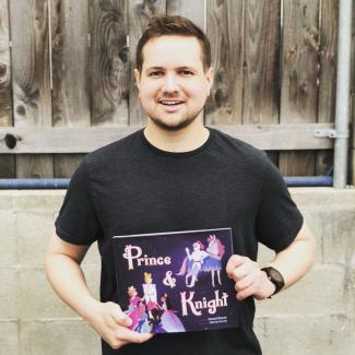 Dan Haack '10 with his book, "Prince & Knight"