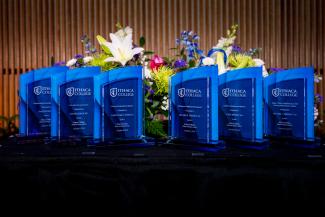 Blue glass awards on a table