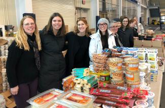 IC staff members volunteer at a food pantry on campus