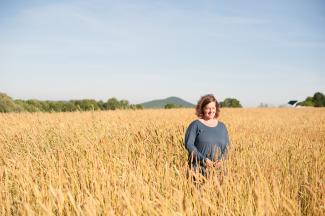 Amber Lambke in a field of grain