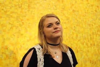 woman in front of yellow background