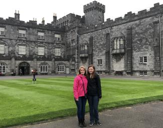 two students in front of a castle in Ireland