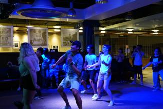 People dancing under blue lights