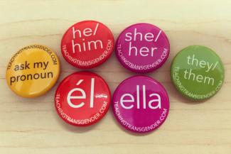 Colorful buttons with pronouns on them
