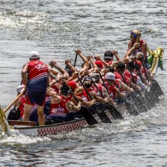 dragon boat in the water with rowers