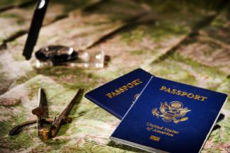 Passports, map and compass