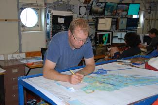 Chris Sinton Looking at Map