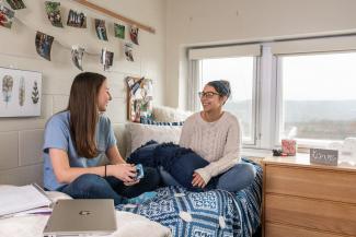 Students talking in a residence hall 
