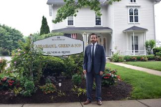 man in front of a funeral home