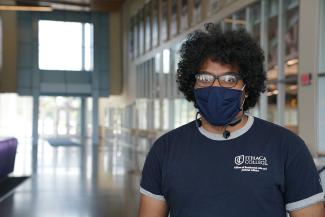 student wearing a mask in the athletics and events center