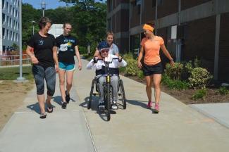 Carrie Callahan '02 (left) and Kelly Pantason '15 (right) with a patient.