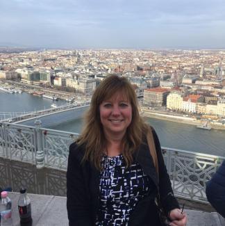 Person standing with Budapest in the background