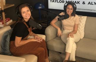 Taylor Misiak and Alyssa Litman on the set of their podcast