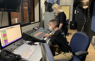Students sitting in a control room