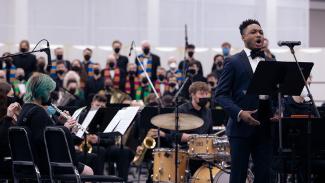 Guest soloist Markel Reed singing, with the Ithaca College Choir & Dorothy Cotton Jubilee Singers, and the college's Wind Symphony, conducted by Ben Rochford
