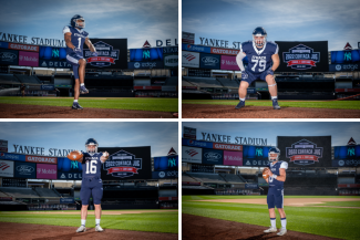 IC's four captains posing on the field at Yankee Stadium