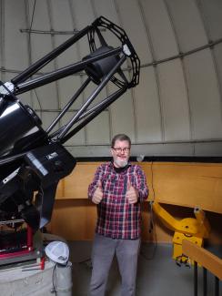 Matt Price celebrates the positioning of the new telescope.