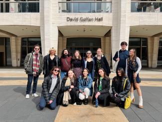 A group of senior Theatre Administration students posing outside of David Geffen Hall in New York City.