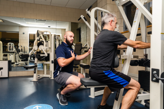 Strength and Conditioning student, Jake Blaisdell '24, working with a client in the Wellness Clinic.