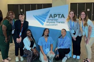 DPT students in front of APTA logo