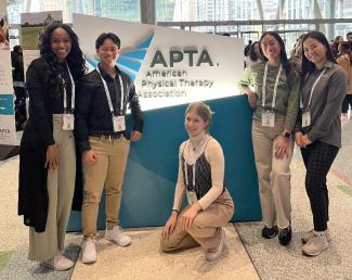 DPT students in front of APTA logo