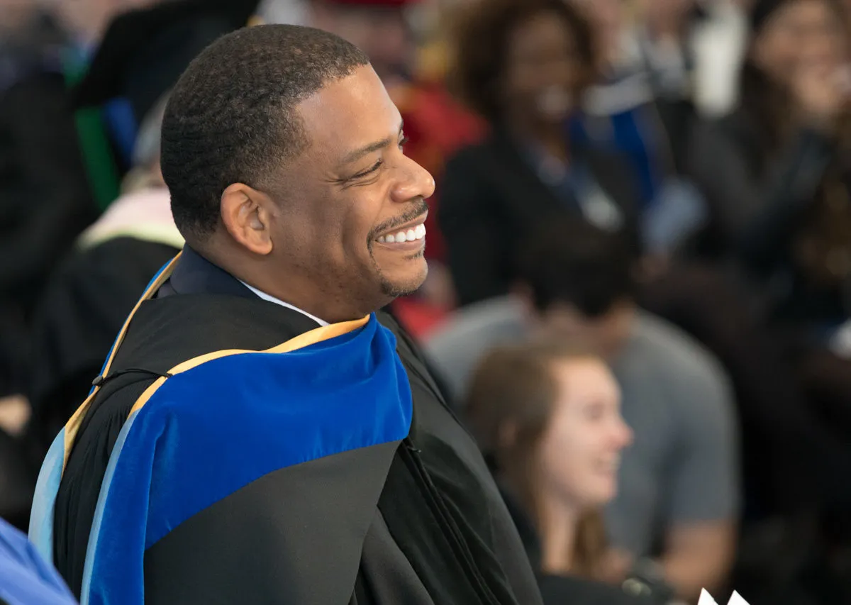 A. Van Jordan smiling in academic robes